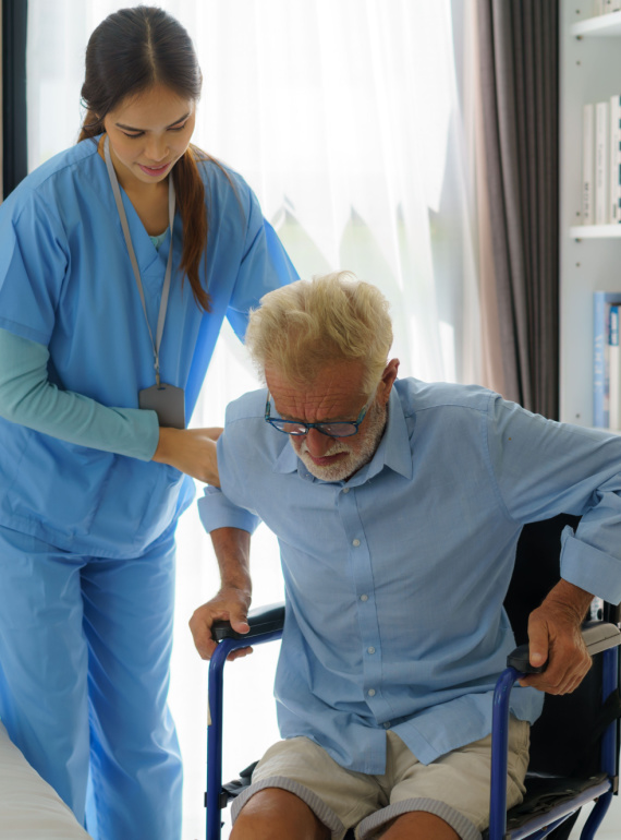 Nurse helping elderly man